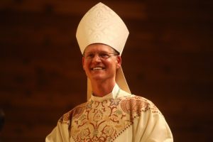 Smiling Bishop Etienne Ordination Mass